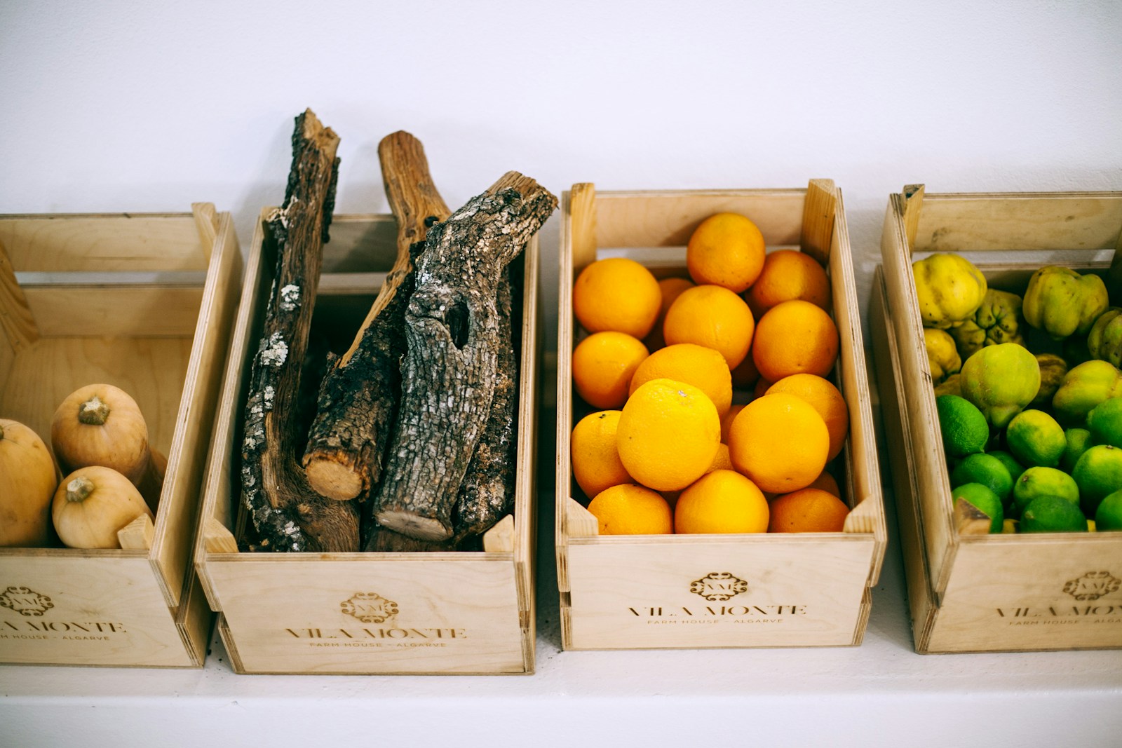 assorted fruits on brown wooden crates